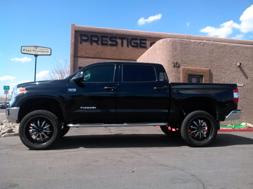 2015 TOYOTA TUNDRA 4 WD WITH 6 ROUGH COUNTRY LIFT KIT AND 24 WHEELS