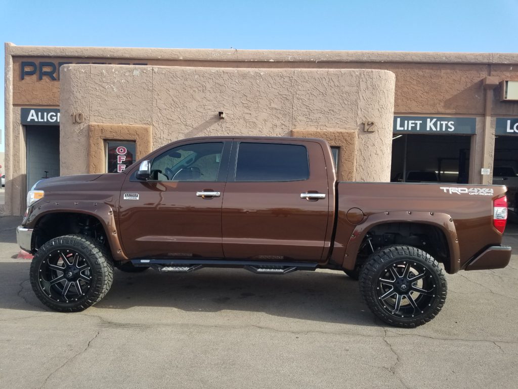 2016 TOYOTA TUNDRA WITH A 6 ROUGH COUNTRY SUSPENSION LIFT KIT AND A SET