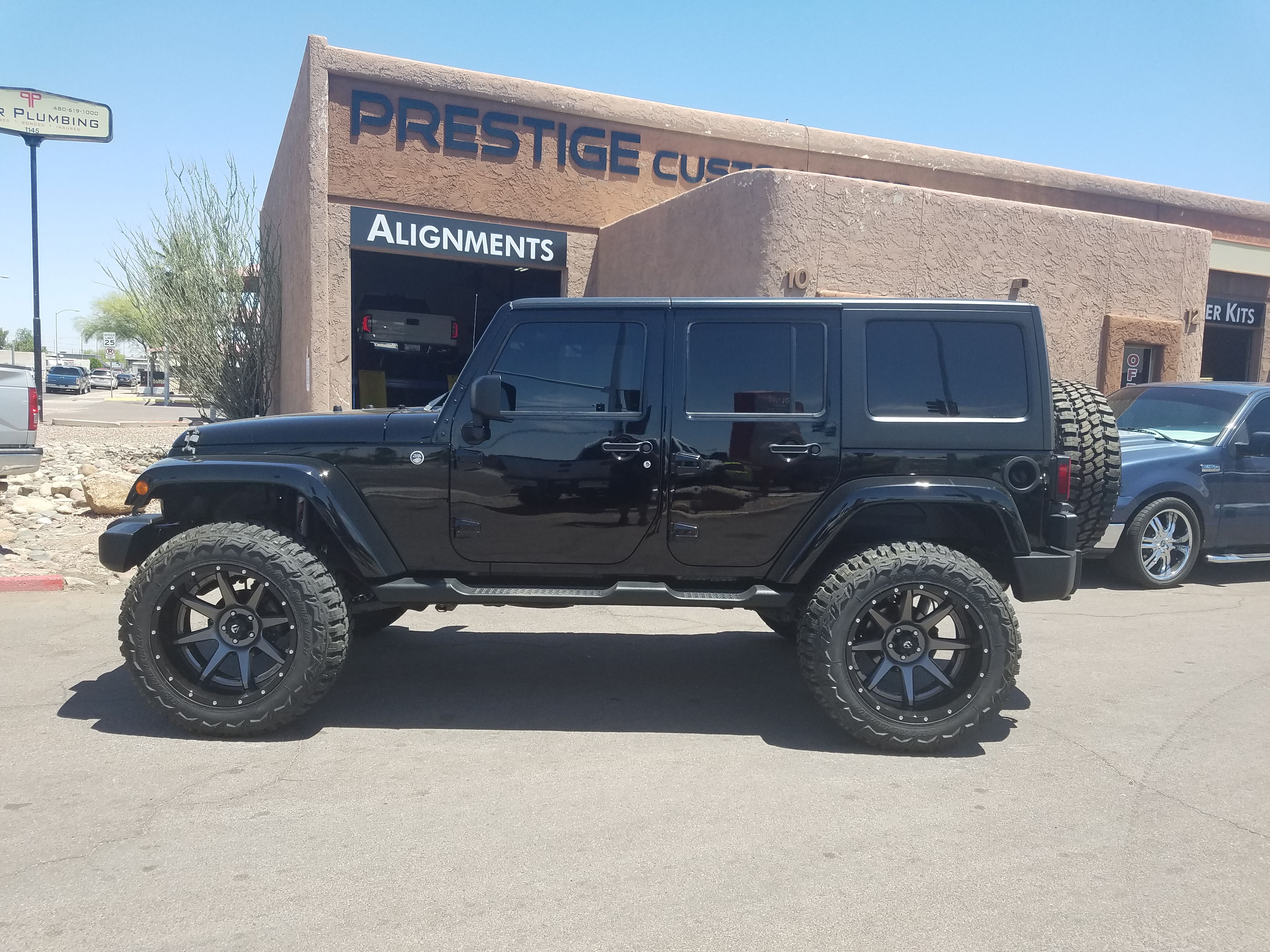 2008 JEEP JK UNLIMITED WITH A 4 ROUGH COUNTRY SUSPENSION LIFT KTI AND A SET  OF FUEL WHEELS 22X12 AND THUNDER MTS 37X13 (2) - Prestige Custom Rides  (480) 733-4303